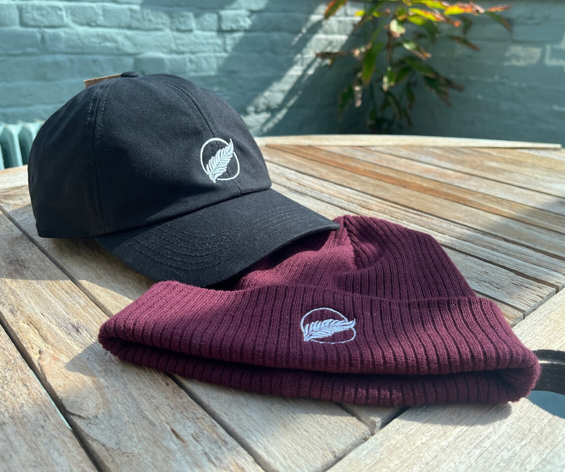 Copyright Roho Rafiki - embroidered cap and beanie