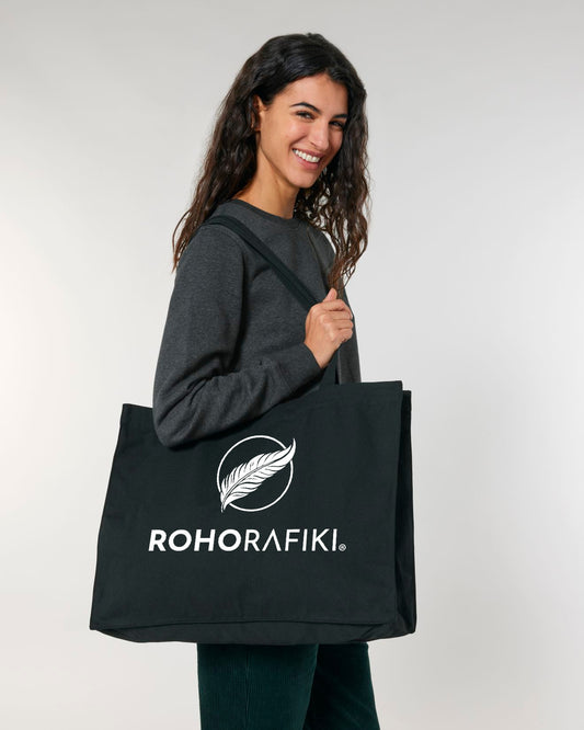 The canvas Roho Rafiki® maxi tote bag with white branded design is a stylish addition to any eco collection. Heavy duty with a large capacity, the maxi tote is ready for anything, when you are. Black.